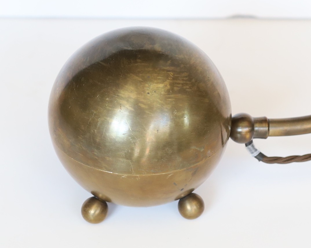 A stylish bronze metal desk lamp with adjustable shade and spherical base, height 53cm